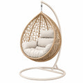 Sillón colgante 105 x 105 x 195 cm de fibra trenzada beige con soporte metálico para interior y exterior cubierto